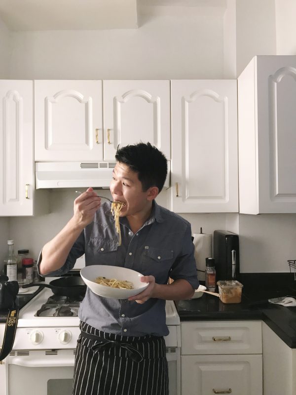 Andrew Bui eating bowl of pho