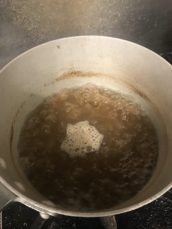 Acorns boiling in water, to release tannins