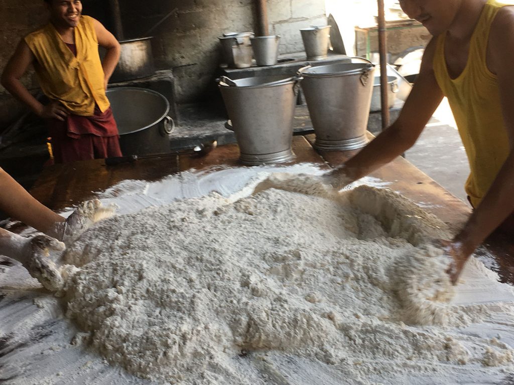 2 boys working the dough