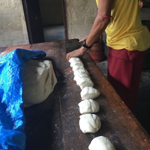 cutting a strip of dough