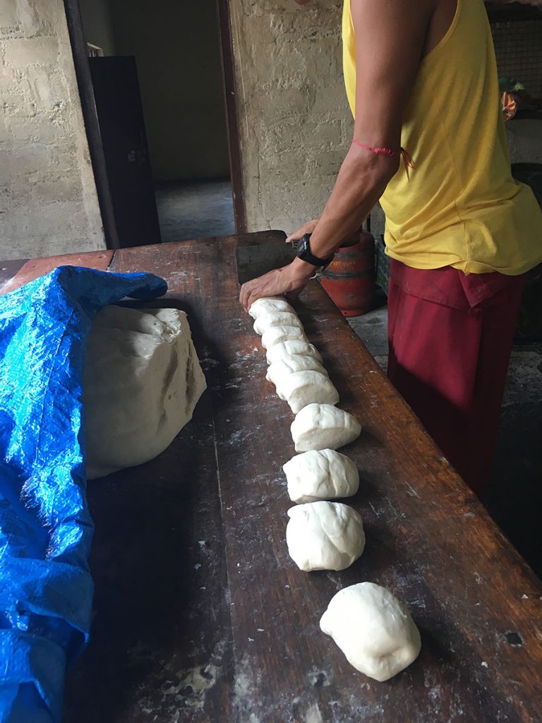 cutting a strip of dough