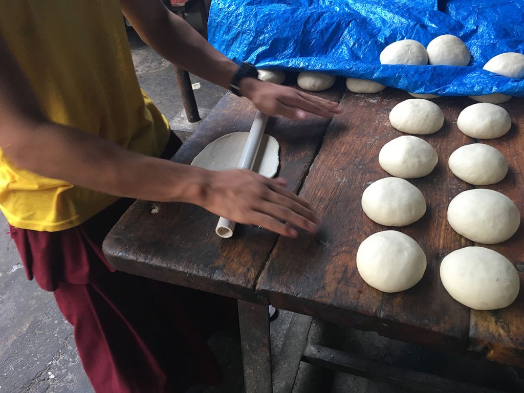 boy rolling dough