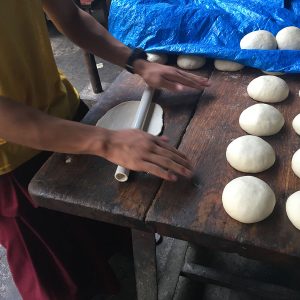 boy rolling dough